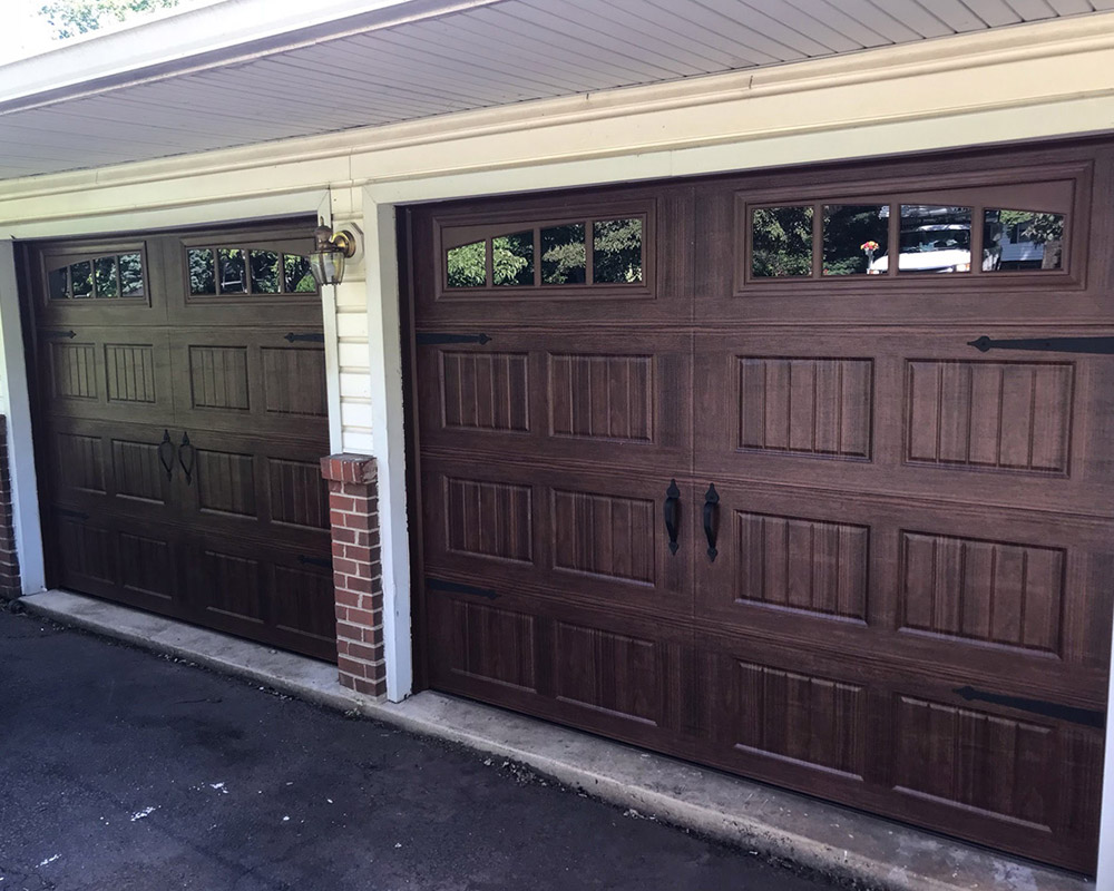 double wooden garage door installed at residential property bealeton va
